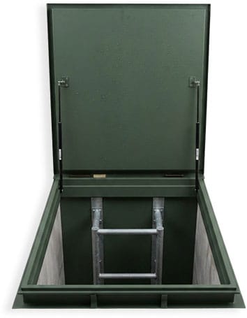 Floor hatch steel door open, revealing a ladder into the shaft below
