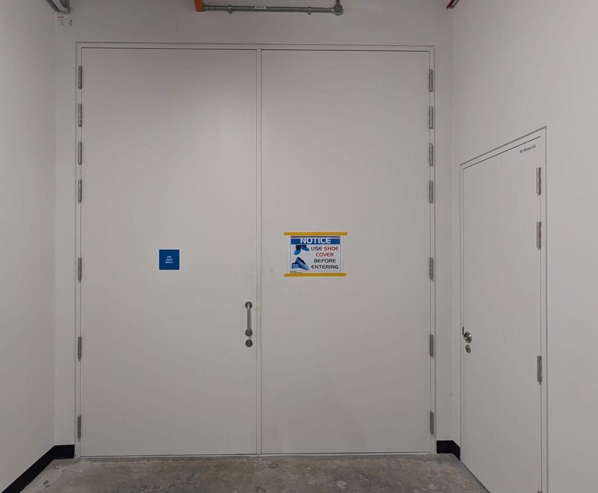 Double-leaf watertight steel doors with centre pull handle