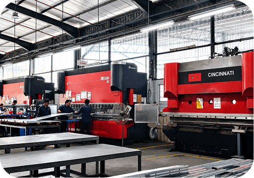 Workshop floor with press brake machines and workers